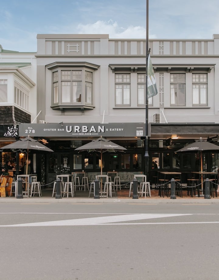 A photo of the front entrance to two iconic Nelson bars, taken from across the street.