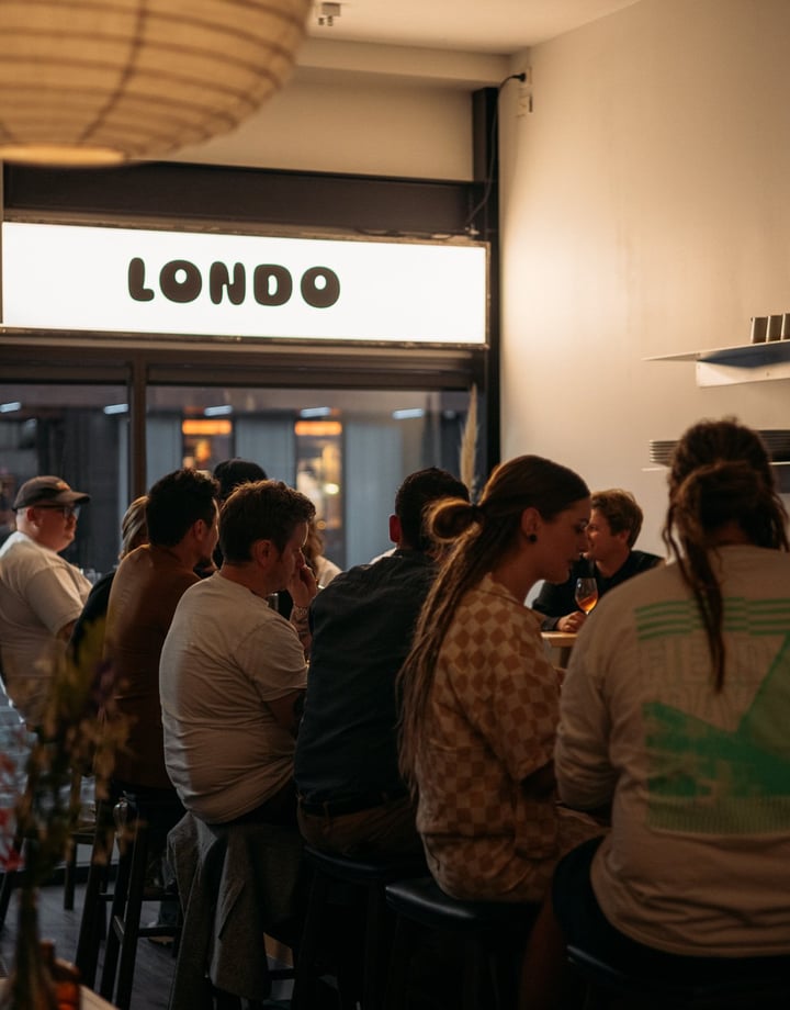 People dining at the bar at Londo.