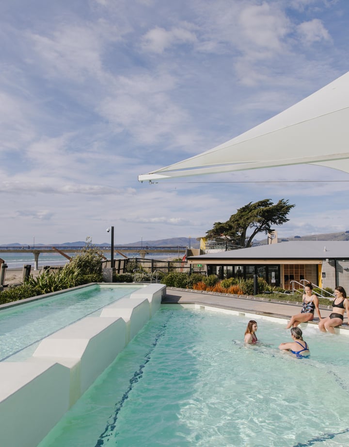 Women soaking in the hot pools at New Brighton Hot Pools in Christchurch.