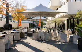 Outdoor seating at Hotel Montreal on a sunny day.