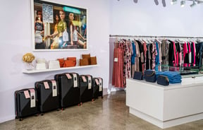 Colourful clothing and bags on display inside Nic&Cole Hastings.