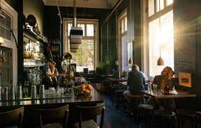 Sunlight streaming through OGB's speakeasy-style bar in Christchurch