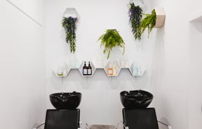 Two chairs and head basins at Refuge Hair Boutique, Wellington.
