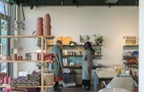 Two women browsing the shelves at Swoon Store Christchurch.