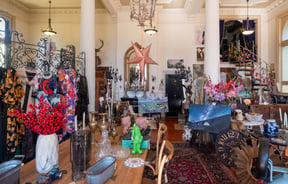 Ornate interior of secondhand and vintage shop with furniture and eclectic decor