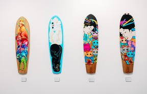 A close up of art painted on to skateboards.