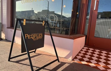 Peoples Coffee footpath sign outside Comes & Goes café in Petone.