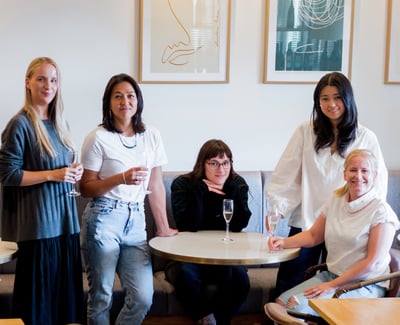 Group of Christchurch female chefs gathered around a table for the Avenues x Earl Event