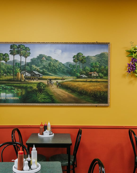Inside Chinese Restaurant with dining table and yellow and red painted wall