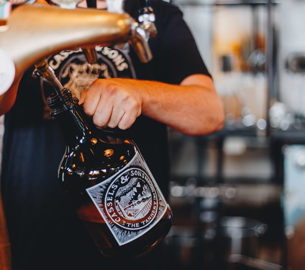 A bottle being filled up with craft beer at The Brewery Christchurch.
