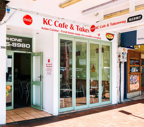 The white and red exterior of K C Cafe in Wellington.