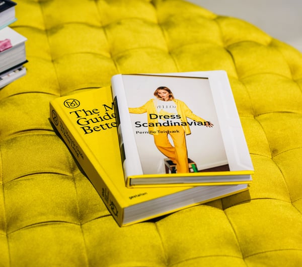 Yellow books on a yellow seat inside Wanda Harland Wakefield Street store in Wellington, New Zealand.