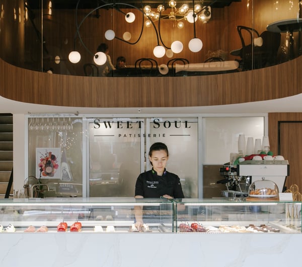 Rea Scur working behind the counter at Sweet Soul Patisserie in Christchurch.