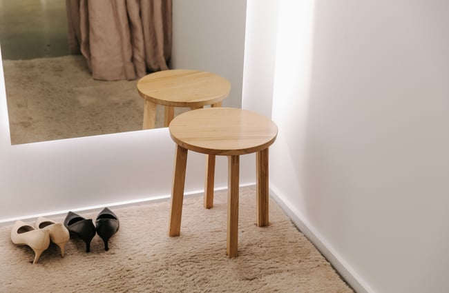 A little wooden stool in the changing room at 47 Frocks.