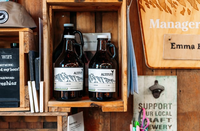 Two beer riggers on display on shelves.