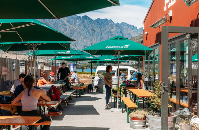 People dining outside Altitude Brewing in Queenstown.