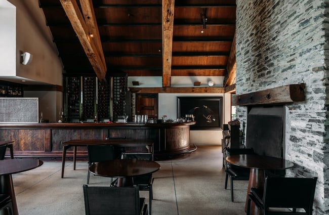 The wooden and brick interior of Amsfield in Queenstown.