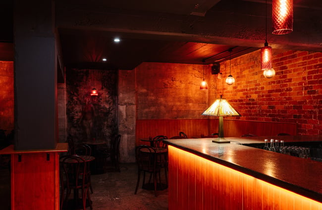 A dimly lit corner of the bar.