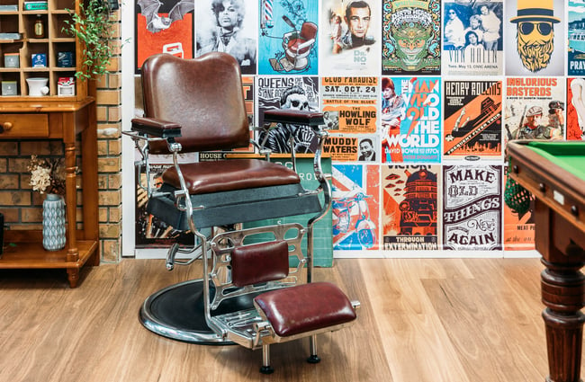A brown leather barber chair.