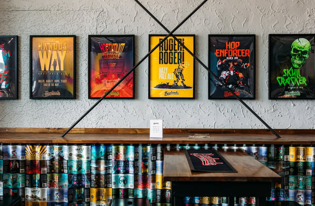 Posters of craft beer prints on the wall at taproom and brewery