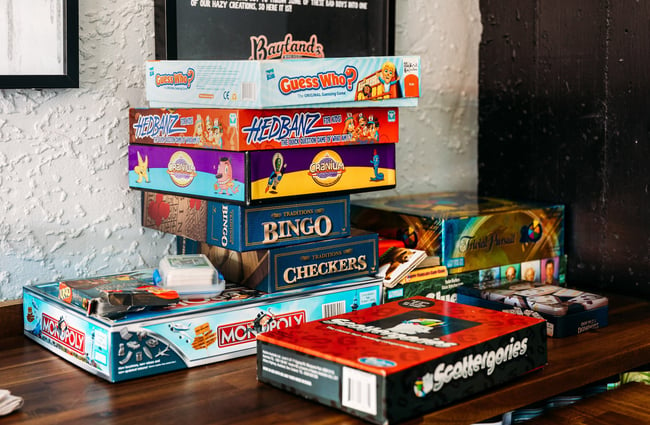 Stack of boardgames available to play at Baylands Brewery in Lower Hutt