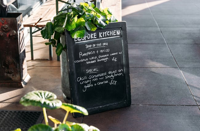 A blackboard sign that says 'Bespoke Kitchen'.