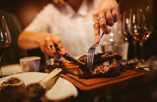 A piece of steak being cut into at Bessie in Christchurch.