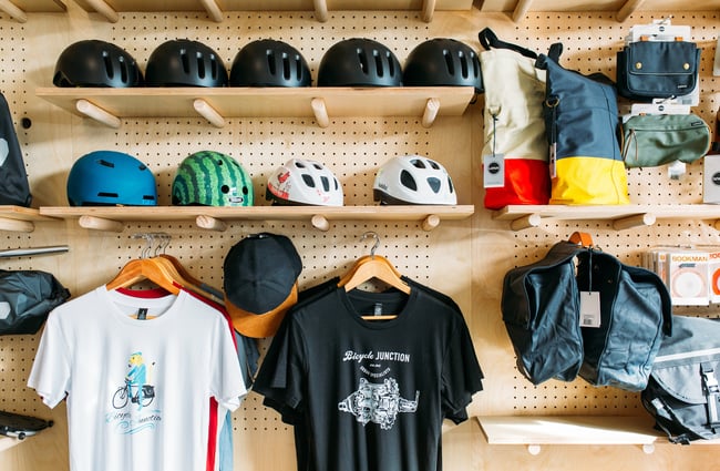 Clothes and helmets on display.