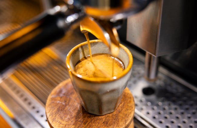 A close up of an espresso being made.