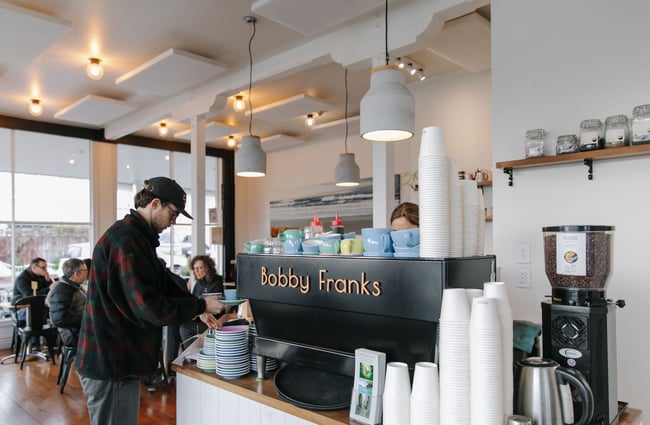 Man collecting a coffee at Bobby Franks.