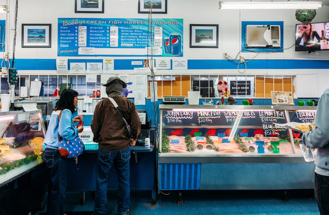 The blue and white interior of a fish supply store.