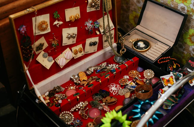 Vintage jewellery in a red box.