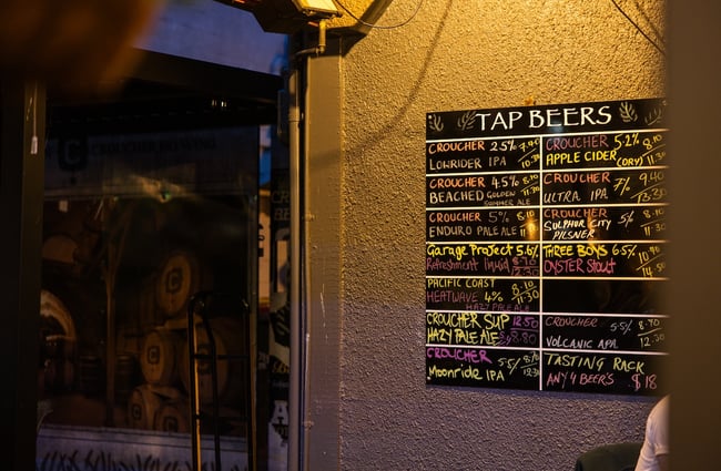 Brew's current tap beer menu on the wall.