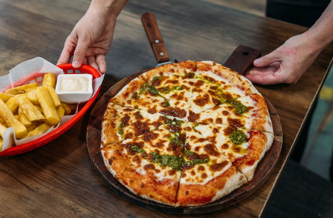 A close up of a pizza on a table.