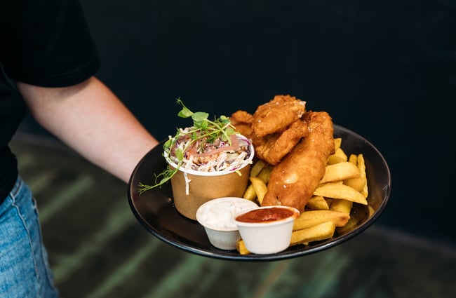Fish and chips on a plate.