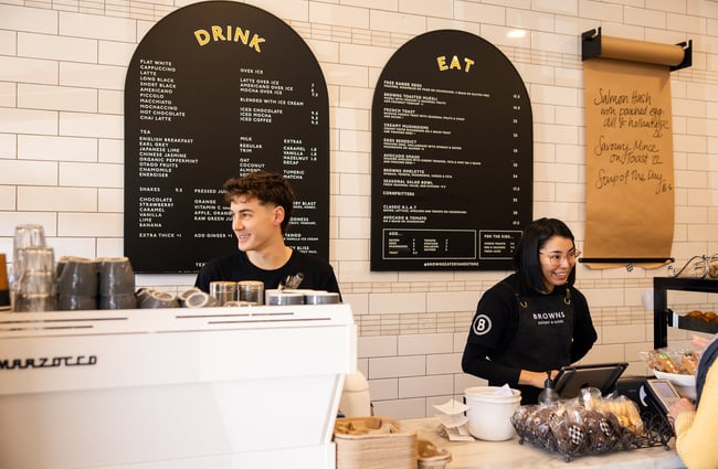Staff smiling behind the counter at Browns Eatery and Store in Auckland.