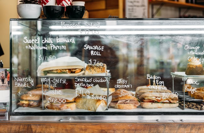 Deli food behind a glass cabinet at Cake & Kitchen cafe in Upper Hutt.