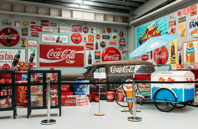 Coca Cola themed walls inside Cars Inc in Upper Hutt.