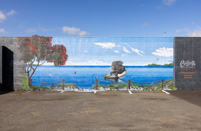 A large mural in front of car parks at Ciabatta.