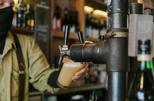 Barman pouring a pint of beer at Civil and Naval in Lyttelton.