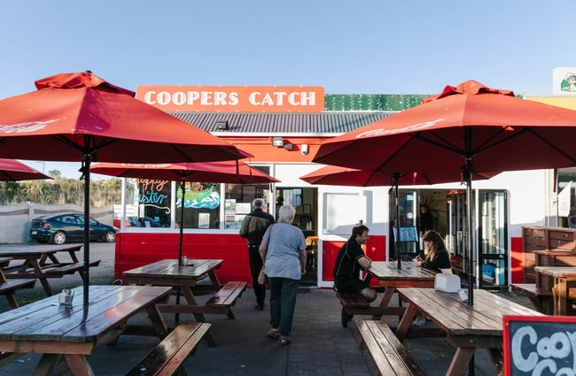 Customers in the outdoor seating area at Coopers Catch.