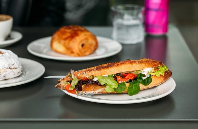 A close up of a sandwich on a table inside Cupple Hastings.