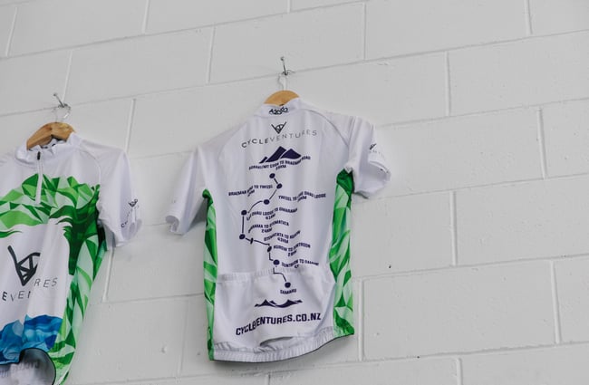 Cycling t-shirt hanging on the wall at Cycle Ventures in Waitaki.