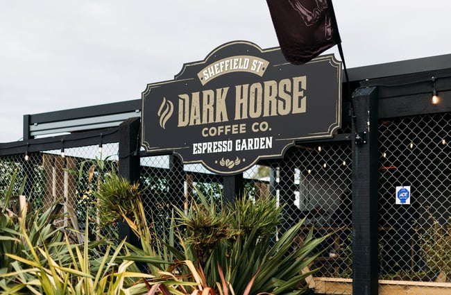 Close up of the Dark Horse sign on the outside of the building.