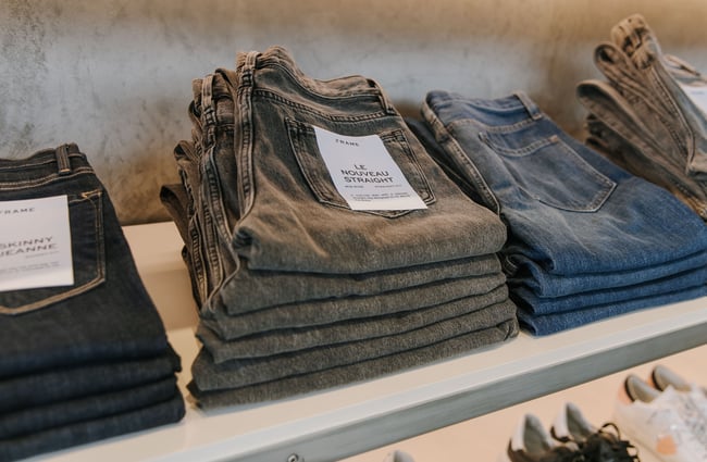 Folded jeans on display at DEVàl Boutique, Wānaka.