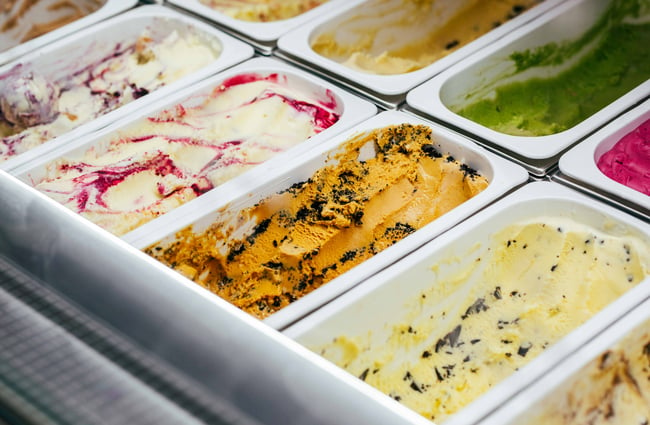 Close up of ice creams in tubs.