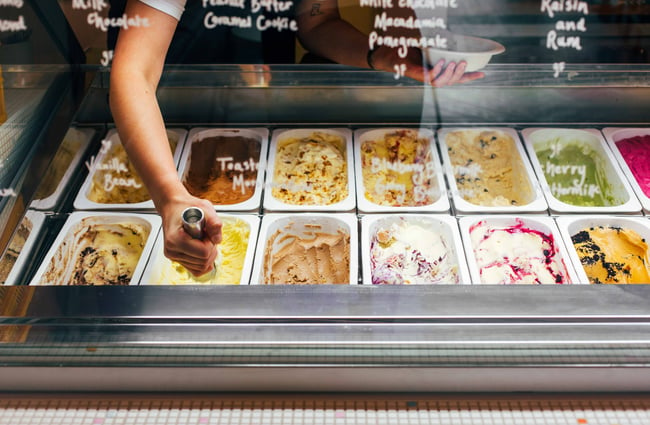 View of all the different types of ice cream in the fridge.