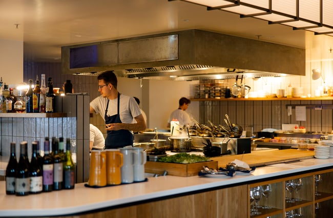 Chefs cooking away in the open kitchen of Earl in Christchurch