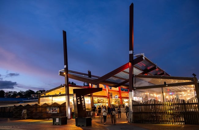 The entrance to Eat Streat in Rotorua at dusk, illuminated by the bars and restaurants down the alley.