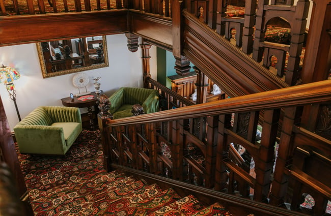 Looking down the big wooden staircase inside Eliza's Manor, Christchurch.